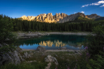The reflection of LAGO DI CAREZZA with a reflection view point on Italy