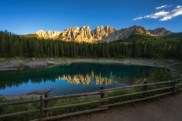 The Carezza lake with a sunset times background