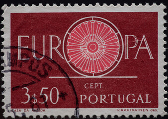PORTUGAL - CIRCA 1960: a postage stamp from PORTUGAL , showing a wagon wheel as a symbol of solidarity within Europe. Text: Europe CEPT Circa 1960