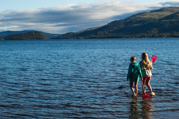 Children having fun playing on Loch Lomond Beech 