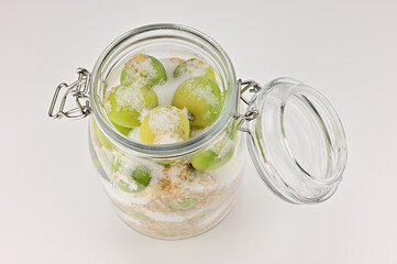 Bottling of plums and sugar.