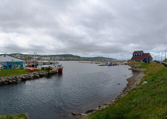A section of Bonavista, Newfoundland (the town and the harbour) is seen on a gloomy and overcast day.
