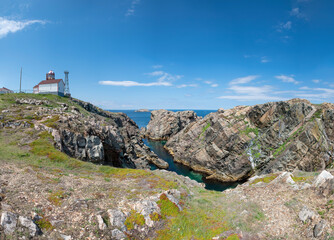 Fototapeta premium A panoramic view of the Cape Bonavista lighthouse in Newfoundland, as it watches over the rocky shoreline of the peninsula.