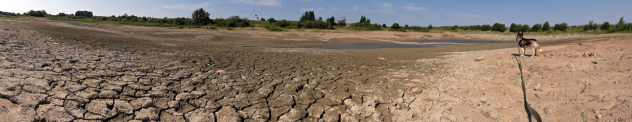 Drying lake. Impact of extreme weather conditions and climate change, impact of drought.
