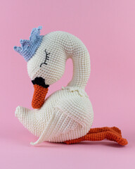 A knitted swan, a handmade toy.