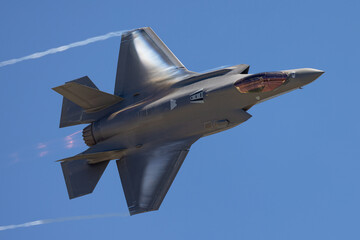 Very unusual close view of a F-35A Lightning II  in a high G maneuver , with condensation clouds...