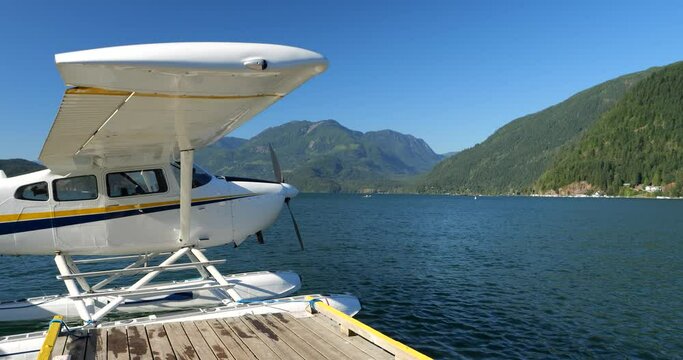 Hydroplane tied to the water aerodrome on Harrison Lake over blue sky in Harrison Hot Springs, British Columbia, Canada
