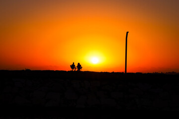 silhouette of a couple in the sunset