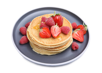 Tasty pancakes with fresh berries and honey on white background