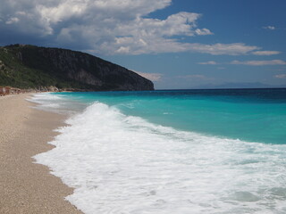 Panoramic summer view of public beach in Dhermi town. Colorful seascape of Adriatic sea. Attractive spring scene of Albania, Europe. Traveling concept background.
