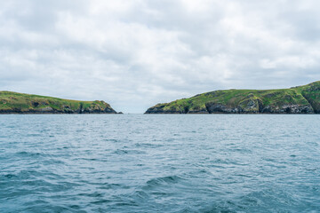 Fototapeta na wymiar View of Skomer Island from a boat, Wales, UK