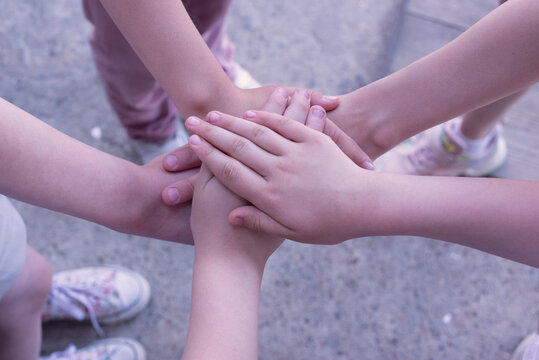 People's hands. Team concept. Many hands are clasped together.