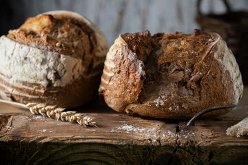 Fresh broken bread on a wooden table