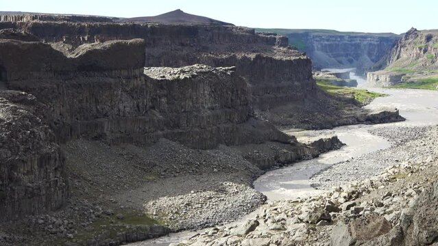 Fantastic landscape with flowing rivers and streams with rocks and grass in Iceland.