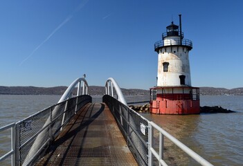 Lighthouse and bridge in the river
