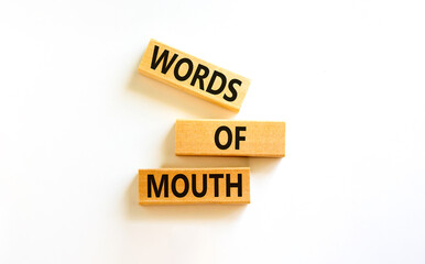 Words of mouth symbol. Concept words Words of mouth on wooden blocks on a beautiful white table white background. Business, finacial and words of mouth concept. Copy space.