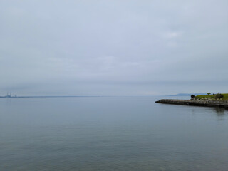 The front view in the morning sky is bright blue with clear white clouds. And the ocean deep indigo...