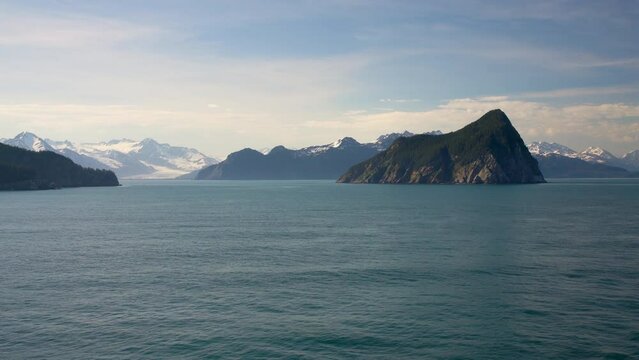 View of the islands and coastline of Resurrection Bay near Seward in Alaska as cruise ship sails away onto Alaskan cruise