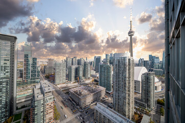blue skies  and cloudsToronto skyline cn tower and condos and Buisness buildings and streets drone...