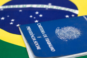 LAURO DE FREITAS, BRASIL - JULY 21, 2022 : Brazilian work document with Brazilian flag