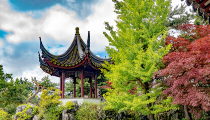 Fototapeta na wymiar A traditional chinese pagoda in a chinese garden in Chinatown in in downtown Vancouver, BC, British Columbia, Canada