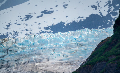 Close up of crevasses on the Mendenhall Glacier as it enters lake close to Juneau in Alaska