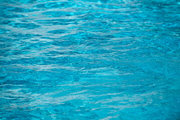 Water in swimming pool, background with high resolution. Wave abstract or rippled water texture.