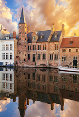 Rozenhoedkaai canal (Quai of the Rosary), and Belfort van Brugge’s Belfry Tower. Typical view of Bruges (Brugge), Belgium.