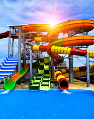 aquapark with slides and a swimming pool. summer holidays.