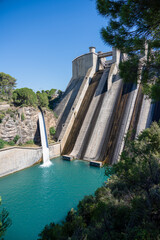 El Grado Dam, Hydro-Electricity Generation, Huesca, Spain, a concrete hydro-electric reservoir dam, clear blue sky