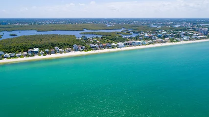 Foto op Canvas Aerial Drone View of the Coast of Bonita Springs, Florida with Barefoot Beach and Real Estate Featuring the Bay and Mangroves in the Background, and the Gulf of Mexico in the Foreground © Ray Dukin