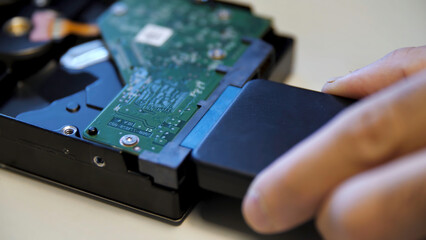 Concept of neuronet and computer technologies. Media. Close up of connecting an external adapter to...