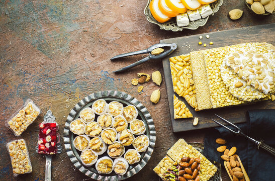 Varieties of traditional candies and sweets to celebrate "Prophet Muhammad's Birthday event". Top view with copy space.