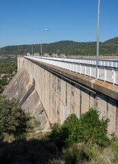 El Grado Dam, Hydro-Electricity Generation, Huesca, Spain, a concrete hydro-electric reservoir dam, clear blue sky