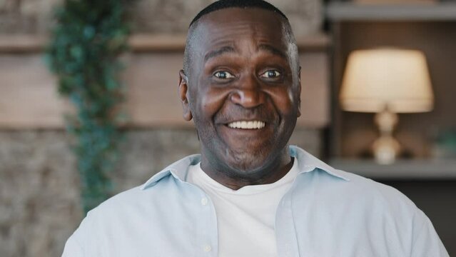 Portrait of african mature middle aged hipster american adult man grandfather senior happy bachelor in casual clothes posing indoors nodding head answering yes approval supporting idea agree reaction