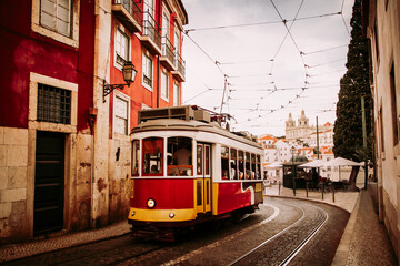 Naklejka na ściany i meble Vintage tram in Alfama historical district of Lisbon, Portugal