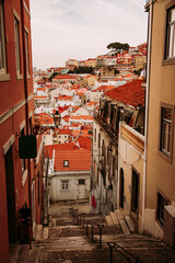 Alfama old town street and stairs in Lisbon during sunset, Portugal