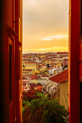Alfama old town street in Lisbon during sunset, Portugal
