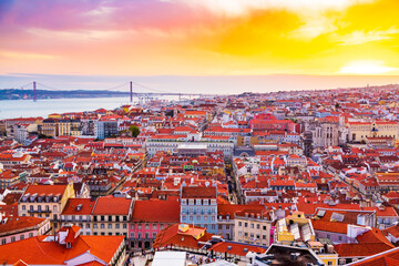 Fototapeta na wymiar Beautiful panorama of old town and Baixa district in Lisbon city during sunset, seen from Sao Jorge Castle hill, Portugal