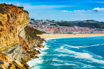 Nazare, Portugal: High Cliff over Atlantic Ocean with Nazare town in the background, Portugal