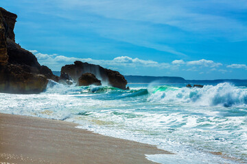 Big waves crash into the rocks of North beach in Nazare city, Portugal