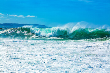 Big blue ocean waves with white foam