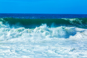Fototapeta premium Big blue ocean waves with white foam