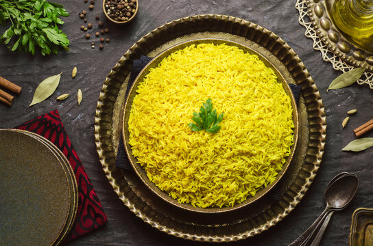 Arabic cuisine; Traditional plain Basmati rice. Topped with fresh parsley. Close up with copy space