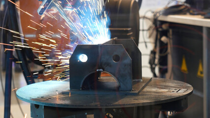 The sample of the robot arm during welding process, automatic work, technology and industrial...