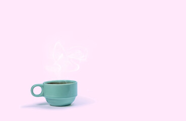 Fototapeta na wymiar Green coffee cup on pink background.