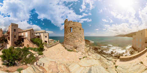 Aerial panorama of the tower of Erbalunga town city harbor in Corsica island of France. Aerial view of the seascape and the city cliff in Tyrrhenian and Mediterranean sea.