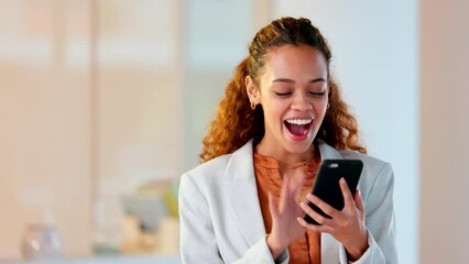 Happy business woman texting on a phone in an office. One confident and cheerful young corporate executive laughing and smiling while networking with clients and reading messages with good news
