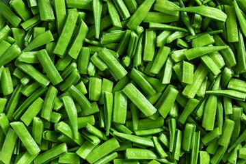 fresh chopped or cut indian vegetable green cluster beans or guar beans ready for cooking,can use as food,health related concept background