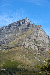 Copy space landscape of Table Mountain in a serene nature reserve and environmental national park with green trees and plants. Rough hiking terrain, blue sky and copyspace in Cape Town, South Africa